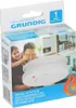 The image shows the packaging of a Grundig smoke detector, featuring a family scene and product details. Produktbild-Vorschau