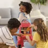 Three children are playing with a Play-Doh pizza delivery scooter set indoors. Produktbild-Vorschau