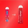 Two bottles of Durex lubricant are shown side-by-side with an arrow indicating a transition or comparison. Produktbild-Vorschau