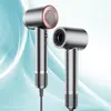 Two silver hairdryers are shown against a light blue and white abstract background. Podgląd zdjęcia produktu