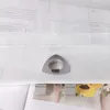 A close-up of a white curtain with a silver grommet. Produktbild-Vorschau