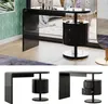 A black high-gloss vanity table with a cylindrical drawer unit is shown in a room setting and in separate product shots. Podgląd zdjęcia produktu