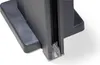 A close-up view of the bottom corner of a black structure, possibly a pergola component, with a clear plastic piece visible. Produktbild-Vorschau
