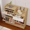 A shoe cabinet with multiple shelves and drawers, displaying various shoes and accessories. Voir les images du produit