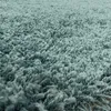 A close-up view of a shaggy rug. Produktbild-Vorschau