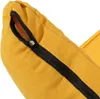 A close-up view of a yellow fabric item with a black zipper. Podgląd zdjęcia produktu