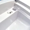 A close-up view of a white plastic device with a clear tube inserted into a hole. Produktbild-Vorschau