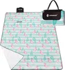 A folded picnic blanket with a flamingo pattern and a carrying case. Produktbild-Vorschau