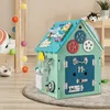 Drewniany domek do zabawy z grami sensorycznymi i schowkami Podgląd zdjęcia produktu 1