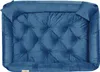 A top-down view of a blue velvet dog bed with tufted detailing and small corner pillows. Voir les images du produit