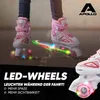 Close-up of children's roller skates with LED wheels, with text overlays highlighting features. Produktbild-Vorschau