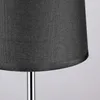 Close-up of the bottom part of a dark gray fabric lampshade supported by a silver pole. Produktbild-Vorschau