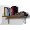 A shelf with books and a wall. Anteprima dell’immagine prodotto