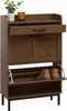A brown wooden shoe cabinet with a drawer and two flip-down compartments for shoes, placed on a white background. Podgląd zdjęcia produktu