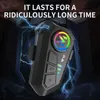 A black Bluetooth headset with a colorful LED logo is shown with lightning effects in the background. Produktbild-Vorschau