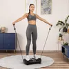 A woman is exercising on a vibration plate in a room. Náhľad obrázku produktu