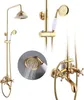 A gold-colored shower system with a rain shower head and a handheld shower head, mounted on a wall. Produktbild-Vorschau