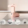 A pink portable fan is displayed on a light-colored surface, with smaller circular insets showing charging options. Anteprima dell’immagine prodotto