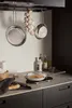 A kitchen scene with cookware and food. Podgląd zdjęcia produktu