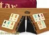 A close-up shot of a Rummy/Okey game set laid out on a wooden board, with tiles and racks visible. Anteprima dell’immagine prodotto