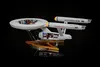 A model of the Starship Enterprise from Star Trek, displayed on a stand against a black, star-filled background. Podgląd zdjęcia produktu