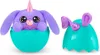 A purple plush toy unicorn bunny peeking out of a teal egg-shaped container, with the other half of the egg to the right. Anteprima dell’immagine prodotto