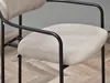 A close-up of a beige upholstered chair with black metal legs. Náhľad obrázku produktu