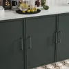 A close-up shot of dark gray kitchen cabinets with silver handles, on a white countertop with a pitcher of lemonade and glasses. Produktbild-Vorschau