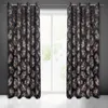 Two black curtains with a gold feather pattern are hanging in front of a window. Produktbild-Vorschau
