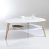 A white, triangular coffee table with wooden legs and two shelves, displayed on a white background. Náhled obrázku produktu