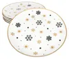 A stack of white plates with a gold rim, decorated with black and gold snowflakes and stars. Náhled obrázku produktu