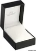 An open black watch box with a white cushion inside. Produktbild-Vorschau