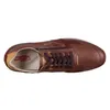 A top-down view of a single brown leather sneaker. Produktbild-Vorschau