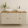 A modern double vanity with two vessel sinks and gold faucets, set against a plain wall. Náhľad obrázku produktu