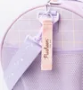 Close-up of a purple backpack with a pink strap and a white Pusheen logo. Produktbild-Vorschau