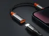 A close-up shot of a USB-C to Lightning adapter cable and a USB-C cable, with a smartphone in the background. Podgląd zdjęcia produktu