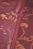 A close-up of a fabric with a floral pattern. Produktbild-Vorschau