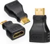 Three black HDMI adapters with gold-plated connectors are arranged on a white background. Anteprima dell’immagine prodotto