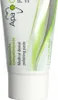 A close-up of a tube of toothpaste with green accents. Voir les images du produit