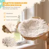 A close-up of a cat bed with fluffy white lining, placed near a window. Náhľad obrázku produktu