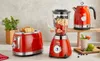 A set of red retro-styled kitchen appliances including a toaster, blender, and electric kettle. Podgląd zdjęcia produktu