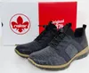 A pair of Rieker sneakers is displayed in front of its branded packaging. Voir les images du produit