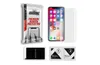 A product shot of a phone screen protector kit, including packaging, a phone, and cleaning supplies. Produktbild-Vorschau