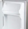 Close-up view of the interior of an empty refrigerator door. Voir les images du produit