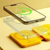 A smartphone, a clear phone case, and a yellow wireless charger are arranged in a layered composition against a yellow background. Voir les images du produit