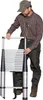 A man is demonstrating a telescopic ladder. Náhľad obrázku produktu