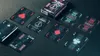 A collection of cyberpunk-themed playing cards and their box are arranged on a dark surface. Voir les images du produit