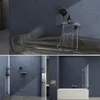 A collage of bathroom scenes featuring a modern bathtub faucet with a waterfall spout and hand shower. Produktbild-Vorschau