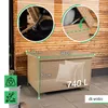 A beige outdoor storage box with dimensions and capacity indicated, placed on a tiled patio against a wooden wall. Náhľad obrázku produktu
