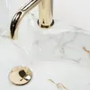 A close-up view of a sink faucet and drain. Podgląd zdjęcia produktu